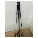 Group of five golf clubs
