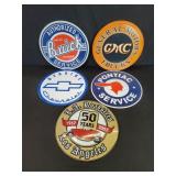 Five tin automotive service and car events wall