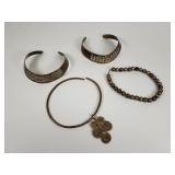 4 brass and copper chokers, one with a celtic