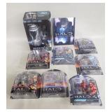 Collection of "Halo" action figures and book