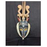 Vintage African carved wood mask with stand