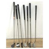Group of eleven golf clubs