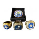 A lot of commemorative Dodge rings