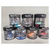 Seven Hot Wheels toy cars