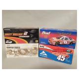 Four NASCAR 1 2:4 scale stock car die-cast models