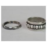 Pair of sterling and silver rings.