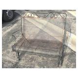 Black wrought iron swinging patio bench