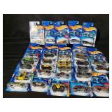 Group of Hot Wheels toy cars, in boxes