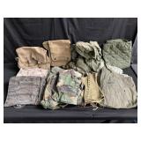 Group of vintage military jackets, bags in a
