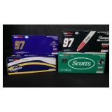 Four signed NASCAR die cast model cars with