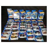 Group of Hot Wheels toy cars, in boxes