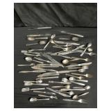 Group of silver plate mismatch flatware in a
