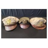 Three WWII era military hats
