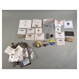 Collection of aviation pins, keychains, etc
