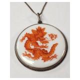 Meissen porcelain pendant with a red court