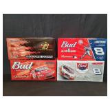 Four NASCAR 1:24 scale diecast model cars