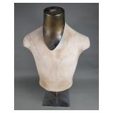 Male torso mannequin form on a metal stand