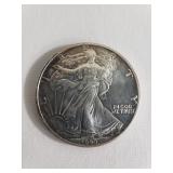 1990 Walking Liberty one dollar silver coin