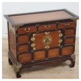 Vintage Asian cabinet with brass accents