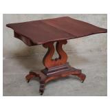 Vintage mahogany veneer game table on casters