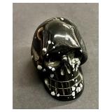 Snowflake obsidian skull paperweight