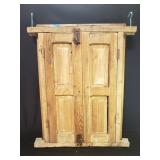 Vintage wood shuttered window with wrought iron
