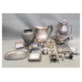 Box of silver plate pitchers, vase, music box,