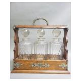 Vintge oak and brass tantalus glass decanter set