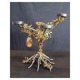 Brass candelabra adorned with glass amber