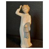 Vintage porcelain boy in pajamas sculpture