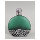 Vintage green frosted glass perfume bottle in