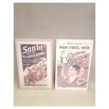 Pair of reproduction poster prints in glass