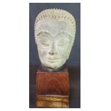 Antique bronze Buddha head filled with clay