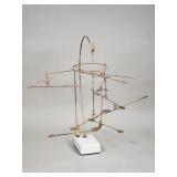 Brass mobile on a marble base