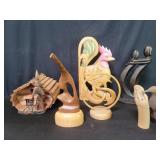 Carved wood figures and birdhouse
