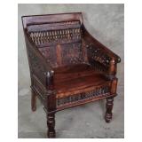 Contemporary carved walnut arm chair