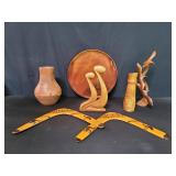 Group of carved wood sculptures, vase, boomerangs