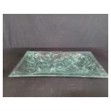 Decorative glass tray featuring a textured,