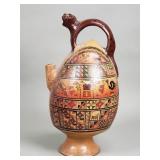 Peruvian pottery jaguar handle pitcher