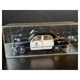 Vintage die-cast 1950 Ford LAPD in lucite box