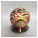 Signed decorative wood sphere by Blanck on metal