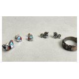 Group of sterling silver earrings and ring.