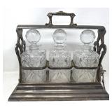 Antique silver plate tantalus set with three