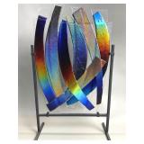 Signed art glass panel on a metal stand