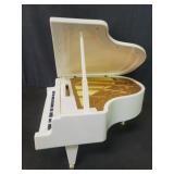 Battery operated musical white plastic piano
