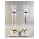 Glass candlestick columns on onyx base