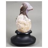 Purple chalcedony baby bird hatching from an egg