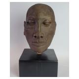 Vintage terracotta head sculpture on a wood base