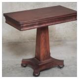 Antique mahogany flip top game table on casters