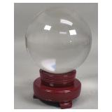 Crystal sphere on swivel wood stand